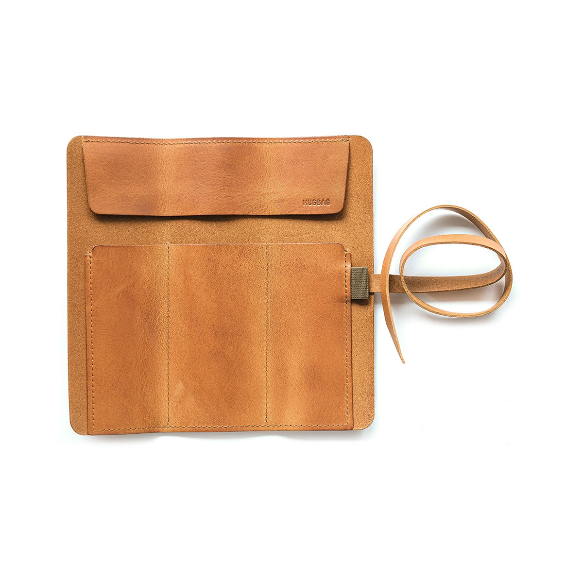 Skórzany piórnik rolowany – koniakowy, HUGBAG, papierniczy design