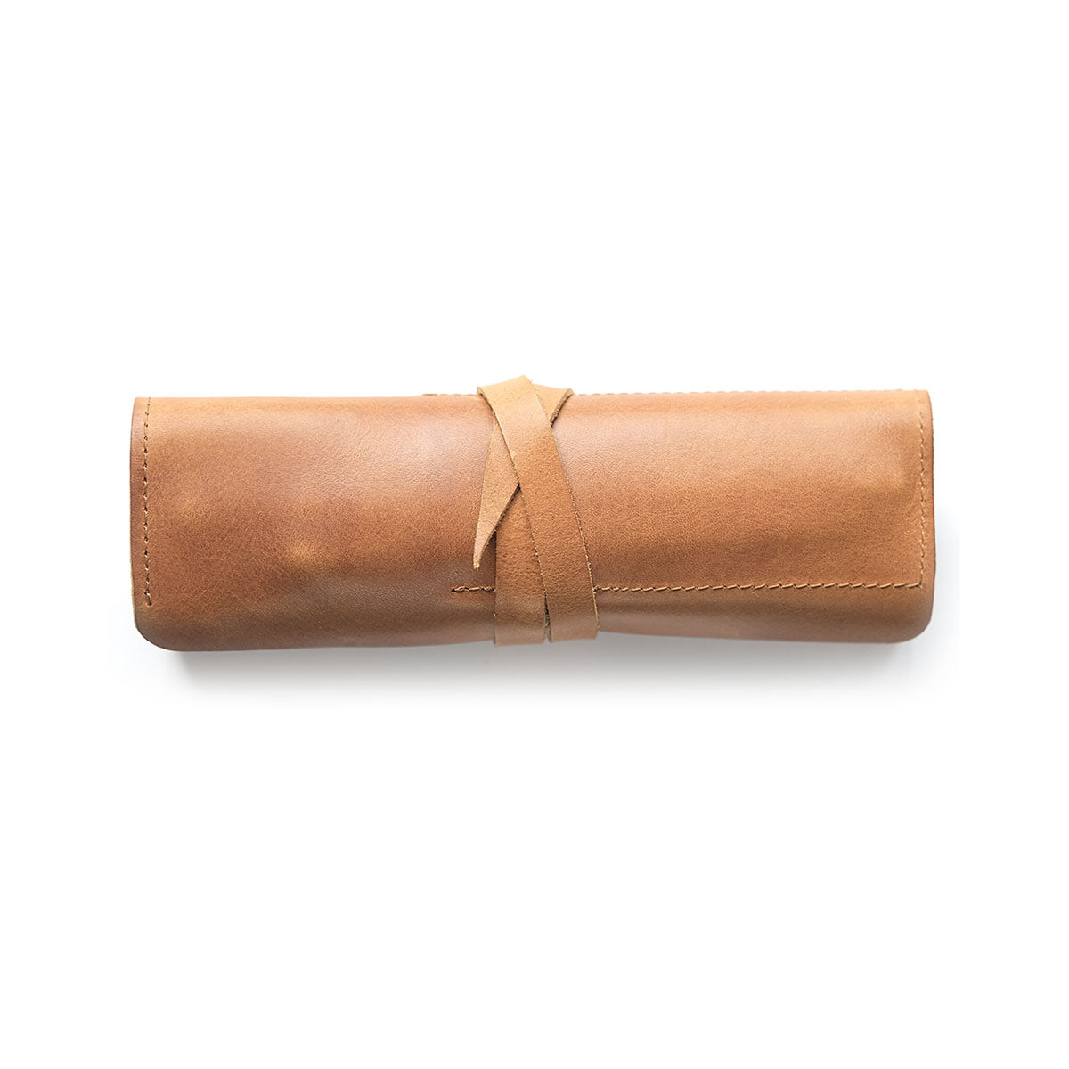 Skórzany piórnik rolowany – koniakowy, HUGBAG, papierniczy design